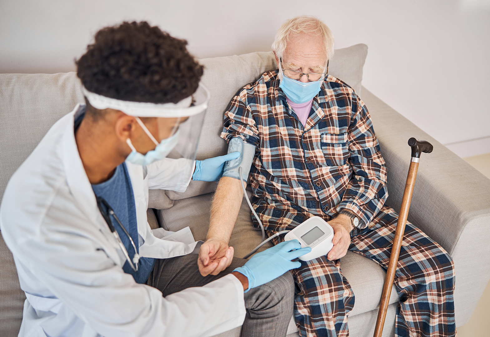 Medical professional using manometer on a patient