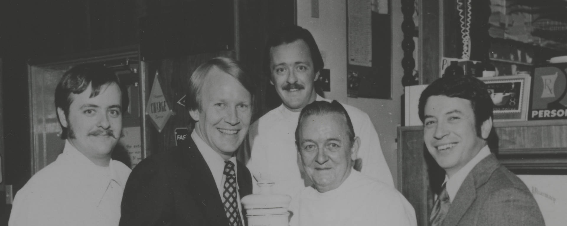 The Besse family receiving an award for filling our two millionth prescription