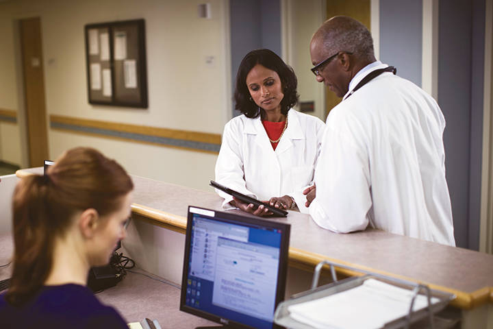 Doctors examining notes